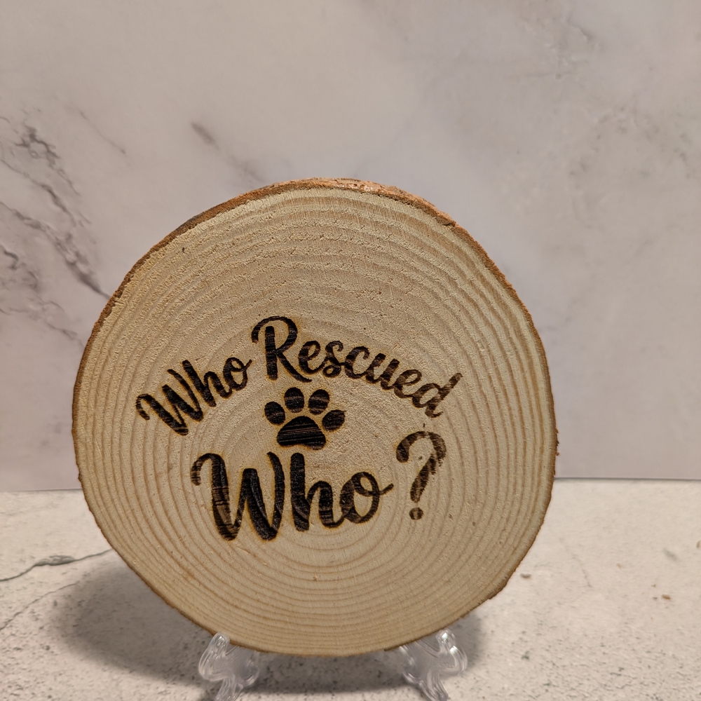 Wooden Plaque with 'Who Rescued Who?' Engraving